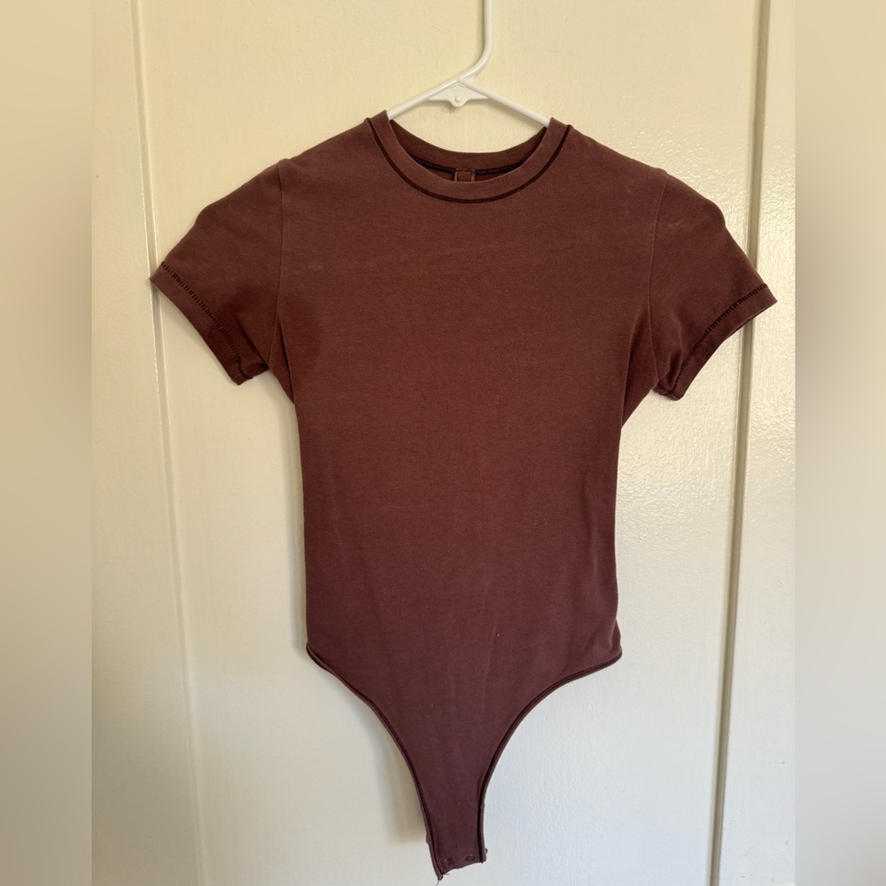 Skims “Fits Everybody” tee shirt bodysuit